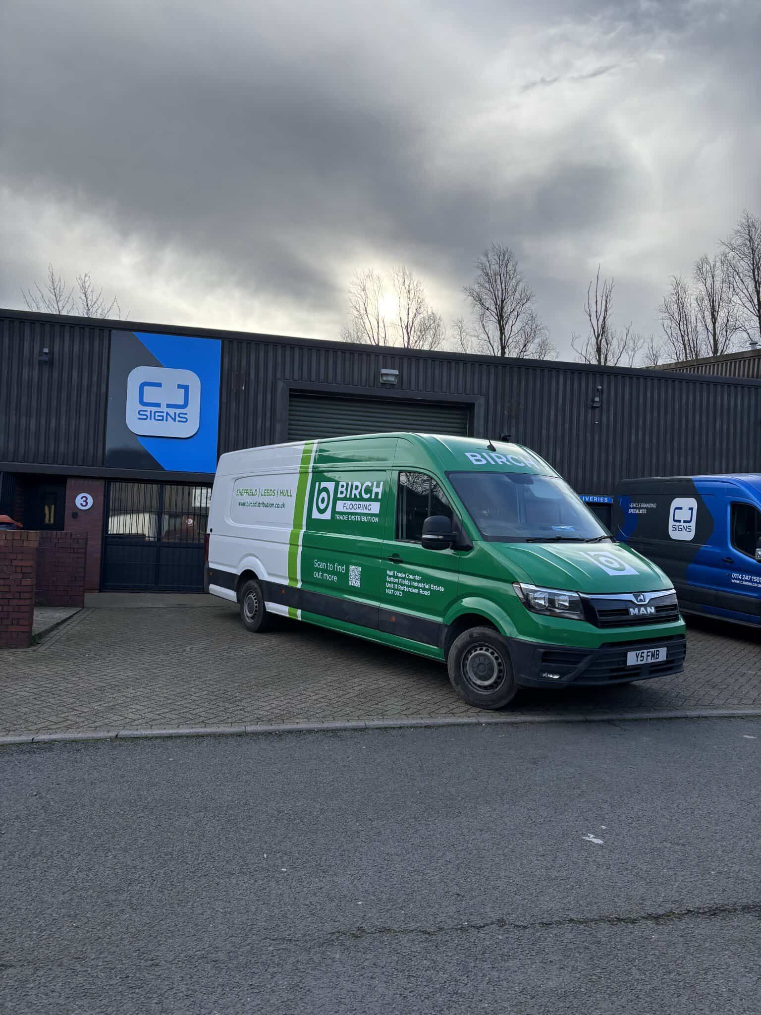 Birch Flooring van wrapping with green and white branding